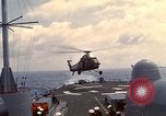 Image of HUS1 UH-34D Seahorse lands on USS North Hampton Atlantic Ocean, 1962, second 23 stock footage video 65675030397