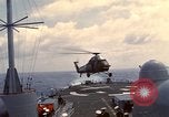 Image of HUS1 UH-34D Seahorse lands on USS North Hampton Atlantic Ocean, 1962, second 24 stock footage video 65675030397