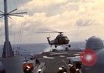 Image of HUS1 UH-34D Seahorse lands on USS North Hampton Atlantic Ocean, 1962, second 25 stock footage video 65675030397