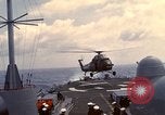 Image of HUS1 UH-34D Seahorse lands on USS North Hampton Atlantic Ocean, 1962, second 26 stock footage video 65675030397