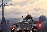Image of HUS1 UH-34D Seahorse lands on USS North Hampton Atlantic Ocean, 1962, second 27 stock footage video 65675030397
