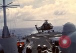 Image of HUS1 UH-34D Seahorse lands on USS North Hampton Atlantic Ocean, 1962, second 28 stock footage video 65675030397