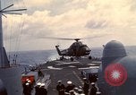 Image of HUS1 UH-34D Seahorse lands on USS North Hampton Atlantic Ocean, 1962, second 30 stock footage video 65675030397