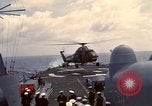 Image of HUS1 UH-34D Seahorse lands on USS North Hampton Atlantic Ocean, 1962, second 31 stock footage video 65675030397