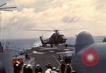 Image of HUS1 UH-34D Seahorse lands on USS North Hampton Atlantic Ocean, 1962, second 32 stock footage video 65675030397