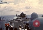 Image of HUS1 UH-34D Seahorse lands on USS North Hampton Atlantic Ocean, 1962, second 33 stock footage video 65675030397