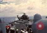 Image of HUS1 UH-34D Seahorse lands on USS North Hampton Atlantic Ocean, 1962, second 34 stock footage video 65675030397