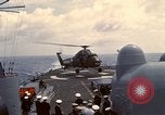 Image of HUS1 UH-34D Seahorse lands on USS North Hampton Atlantic Ocean, 1962, second 35 stock footage video 65675030397