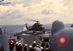 Image of HUS1 UH-34D Seahorse lands on USS North Hampton Atlantic Ocean, 1962, second 36 stock footage video 65675030397