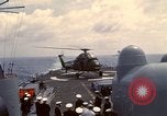 Image of HUS1 UH-34D Seahorse lands on USS North Hampton Atlantic Ocean, 1962, second 37 stock footage video 65675030397