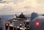 Image of HUS1 UH-34D Seahorse lands on USS North Hampton Atlantic Ocean, 1962, second 38 stock footage video 65675030397