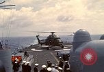 Image of HUS1 UH-34D Seahorse lands on USS North Hampton Atlantic Ocean, 1962, second 39 stock footage video 65675030397