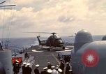 Image of HUS1 UH-34D Seahorse lands on USS North Hampton Atlantic Ocean, 1962, second 40 stock footage video 65675030397
