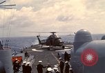 Image of HUS1 UH-34D Seahorse lands on USS North Hampton Atlantic Ocean, 1962, second 42 stock footage video 65675030397
