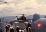 Image of HUS1 UH-34D Seahorse lands on USS North Hampton Atlantic Ocean, 1962, second 43 stock footage video 65675030397