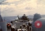 Image of HUS1 UH-34D Seahorse lands on USS North Hampton Atlantic Ocean, 1962, second 46 stock footage video 65675030397