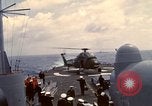 Image of HUS1 UH-34D Seahorse lands on USS North Hampton Atlantic Ocean, 1962, second 48 stock footage video 65675030397