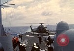 Image of HUS1 UH-34D Seahorse lands on USS North Hampton Atlantic Ocean, 1962, second 49 stock footage video 65675030397
