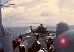 Image of HUS1 UH-34D Seahorse lands on USS North Hampton Atlantic Ocean, 1962, second 52 stock footage video 65675030397