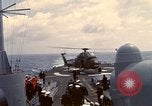Image of HUS1 UH-34D Seahorse lands on USS North Hampton Atlantic Ocean, 1962, second 53 stock footage video 65675030397