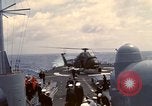 Image of HUS1 UH-34D Seahorse lands on USS North Hampton Atlantic Ocean, 1962, second 54 stock footage video 65675030397