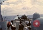 Image of HUS1 UH-34D Seahorse lands on USS North Hampton Atlantic Ocean, 1962, second 57 stock footage video 65675030397
