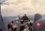 Image of HUS1 UH-34D Seahorse lands on USS North Hampton Atlantic Ocean, 1962, second 59 stock footage video 65675030397