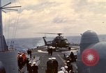 Image of HUS1 UH-34D Seahorse lands on USS North Hampton Atlantic Ocean, 1962, second 61 stock footage video 65675030397