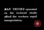Image of man-cars Kennecott Alaska USA, 1927, second 32 stock footage video 65675030414