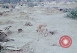 Image of bulldozer levels ground at Fire Base Myron Cambodia, 1970, second 21 stock footage video 65675030461