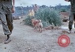 Image of bulldozer levels ground at Fire Base Myron Cambodia, 1970, second 36 stock footage video 65675030461