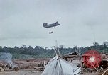 Image of bulldozer levels ground at Fire Base Myron Cambodia, 1970, second 50 stock footage video 65675030461