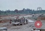 Image of bulldozer levels ground at Fire Base Myron Cambodia, 1970, second 53 stock footage video 65675030461