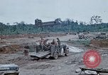 Image of bulldozer levels ground at Fire Base Myron Cambodia, 1970, second 56 stock footage video 65675030461