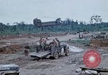 Image of bulldozer levels ground at Fire Base Myron Cambodia, 1970, second 59 stock footage video 65675030461