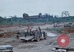Image of bulldozer levels ground at Fire Base Myron Cambodia, 1970, second 60 stock footage video 65675030461