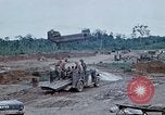 Image of bulldozer levels ground at Fire Base Myron Cambodia, 1970, second 61 stock footage video 65675030461