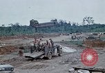 Image of bulldozer levels ground at Fire Base Myron Cambodia, 1970, second 62 stock footage video 65675030461