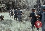 Image of jungle trail Vietnam, 1968, second 32 stock footage video 65675030468