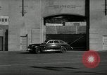 Standbild Wenden mit hoher Geschwindigkeit mit dem Auto vor Stadion Akron Ohio USA, 1941, aus Sekunde 3 historischem Filmmaterial Videoclip 65675030482