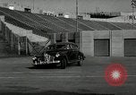 Standbild Wenden mit hoher Geschwindigkeit mit dem Auto vor Stadion Akron Ohio USA, 1941, aus Sekunde 5 historischem Filmmaterial Videoclip 65675030482