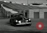 Standbild Wenden mit hoher Geschwindigkeit mit dem Auto vor Stadion Akron Ohio USA, 1941, aus Sekunde 6 historischem Filmmaterial Videoclip 65675030482