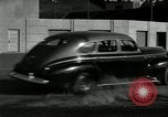 Standbild Wenden mit hoher Geschwindigkeit mit dem Auto vor Stadion Akron Ohio USA, 1941, aus Sekunde 8 historischem Filmmaterial Videoclip 65675030482