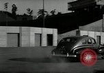 Standbild Wenden mit hoher Geschwindigkeit mit dem Auto vor Stadion Akron Ohio USA, 1941, aus Sekunde 9 historischem Filmmaterial Videoclip 65675030482