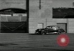 Standbild Wenden mit hoher Geschwindigkeit mit dem Auto vor Stadion Akron Ohio USA, 1941, aus Sekunde 12 historischem Filmmaterial Videoclip 65675030482