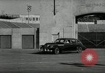 Standbild Wenden mit hoher Geschwindigkeit mit dem Auto vor Stadion Akron Ohio USA, 1941, aus Sekunde 16 historischem Filmmaterial Videoclip 65675030482