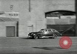 Standbild Wenden mit hoher Geschwindigkeit mit dem Auto vor Stadion Akron Ohio USA, 1941, aus Sekunde 17 historischem Filmmaterial Videoclip 65675030482