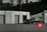 Standbild Wenden mit hoher Geschwindigkeit mit dem Auto vor Stadion Akron Ohio USA, 1941, aus Sekunde 19 historischem Filmmaterial Videoclip 65675030482