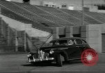 Standbild Wenden mit hoher Geschwindigkeit mit dem Auto vor Stadion Akron Ohio USA, 1941, aus Sekunde 23 historischem Filmmaterial Videoclip 65675030482