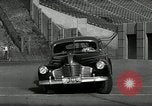 Standbild Wenden mit hoher Geschwindigkeit mit dem Auto vor Stadion Akron Ohio USA, 1941, aus Sekunde 24 historischem Filmmaterial Videoclip 65675030482